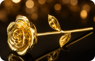 Gold-dipped rose against a bokeh backdrop